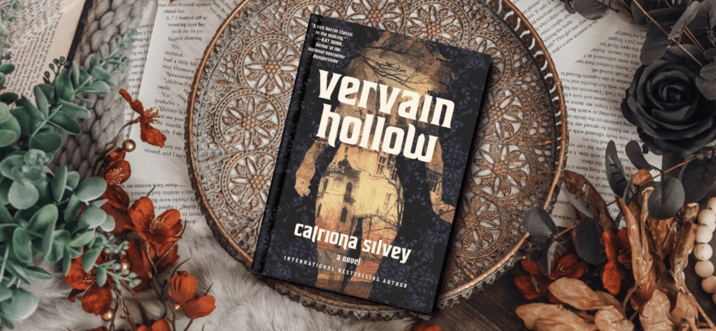 The cover of the book Vervain Hollow. The silhouette of a woman, and inside a gothic house. The background features orange and green foliage and loose pages full of text