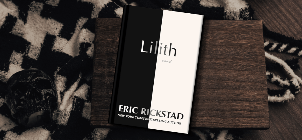 The book cover for the book Lilith by Erik Rickstad. The cover is bisected with the left half being black and the right half being white. The background features a blank and white checked blanket.