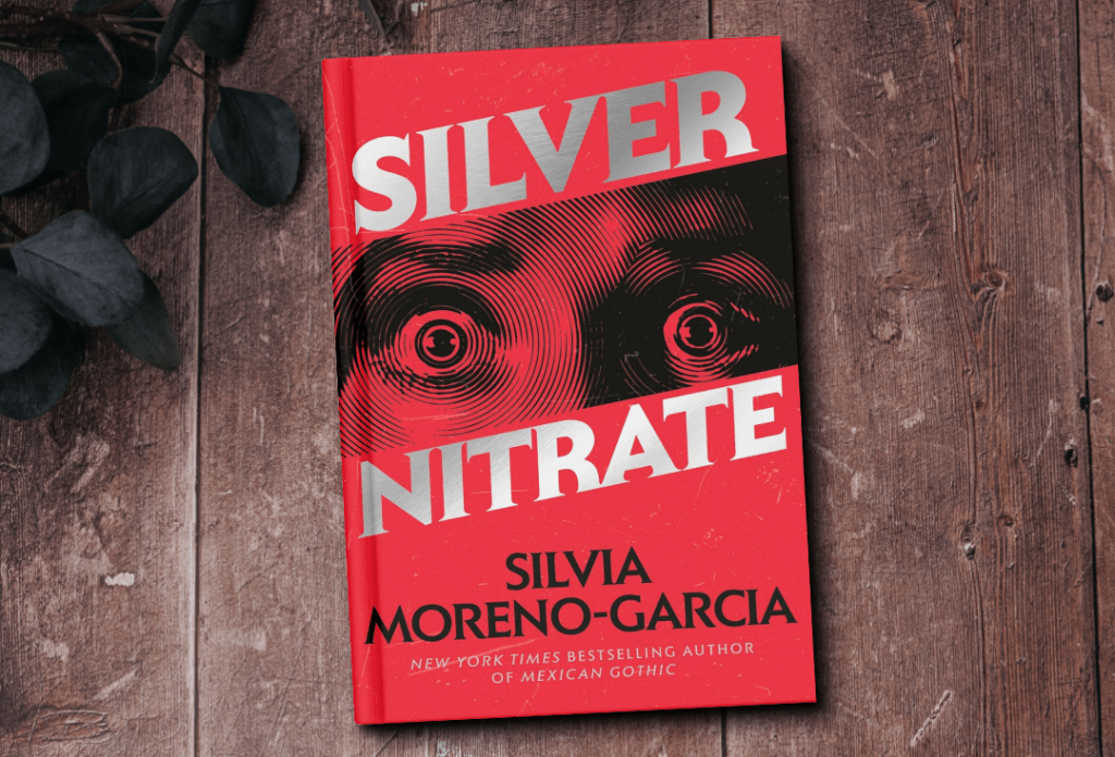 The cover of the book Silver Nitrate by Silvia Moreno-Garcia. The cover features a close up print of a woman's frightened eyes.