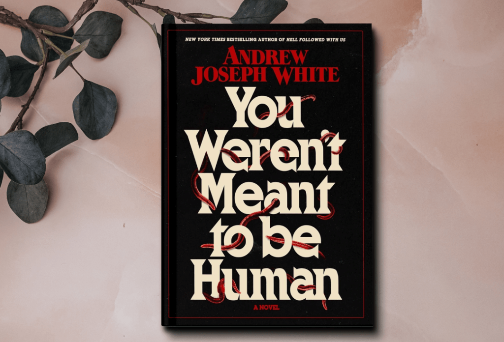 The cover of the book You Weren't Meant to Be Human by Andrew Joseph White. The cover features worms weaving in and out of the text.